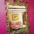 An ornate gilded mirror refects Carmen Victoria's living room designed by Jeanette Maguire. An ornate gilded mirror refects Carmen Victoria's living room designed by Jeanette Maguire.
